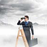 Composite image of businessman looking on a ladder