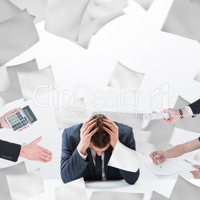 Composite image of businessman in suit offering his hand