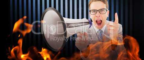 Composite image of geeky businessman shouting through megaphone