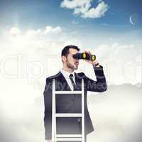 Composite image of businessman looking on a ladder