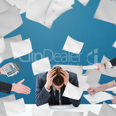 Composite image of businessman in suit offering his hand