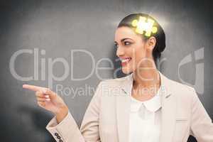 Composite image of smiling businesswoman pointing