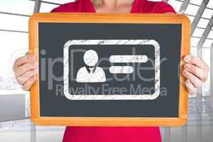 Composite image of woman showing chalkboard to camera