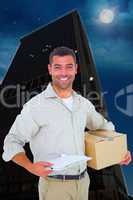 Composite image of delivery man with cardboard box and clipboard