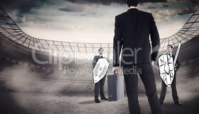 Composite image of rear view of businessman holding a briefcase