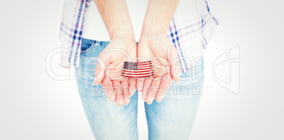 Composite image of hipster showing her hands