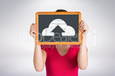 Composite image of woman covering face with chalkboard