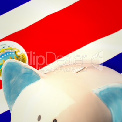 Composite image of piggy bank