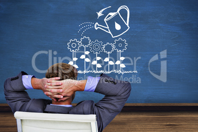 Composite image of relaxed businessman extended on a chair