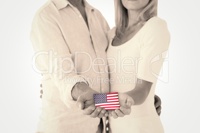 Composite image of happy couple holding their hands out