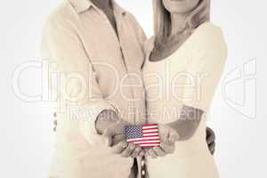 Composite image of happy couple holding their hands out