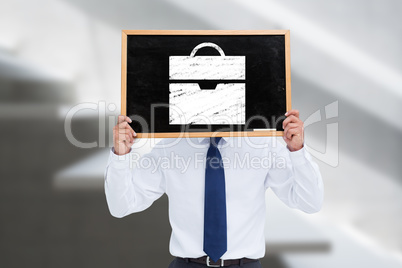 Composite image of businessman showing board