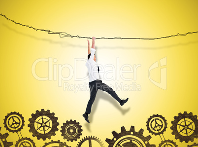 Composite image of cheering businessman