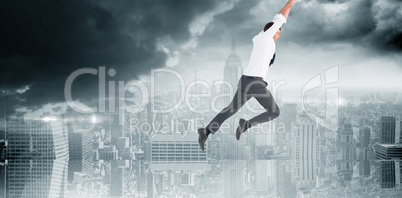 Composite image of flying businessman