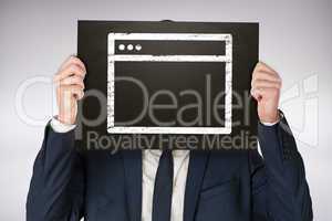 Composite image of businessman holding board