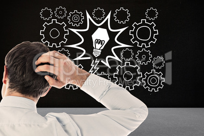 Composite image of businessman scratching his head