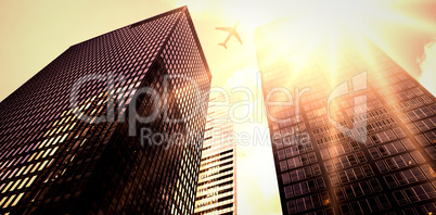 An airplane flying over buildings