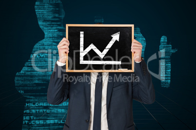 Composite image of businessman holding board