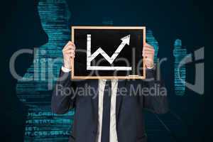 Composite image of businessman holding board