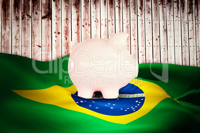 Composite image of piggy bank