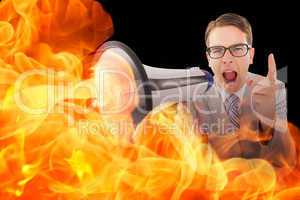 Composite image of geeky businessman shouting through megaphone