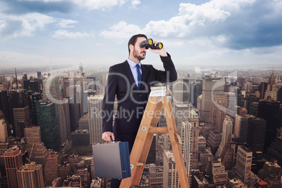 Composite image of businessman looking on a ladder