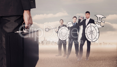 Composite image of businessman holding briefcase