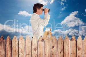 Composite image of businessman looking on a ladder