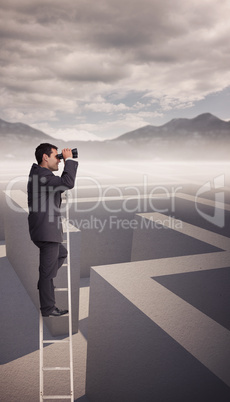 Composite image of businessman standing on ladder