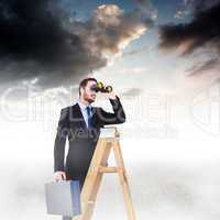 Composite image of businessman looking on a ladder