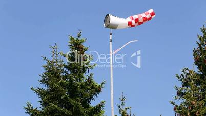 Wind vane in front of blue sky