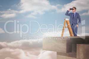 Composite image of businessman looking on a ladder