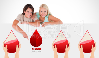 A blood donation sign being pointed at