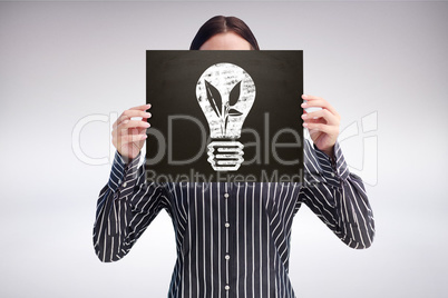 Composite image of businesswoman showing board