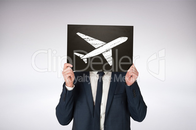 Composite image of businessman holding board