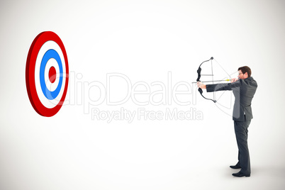 Composite image of businessman shooting a bow and arrow