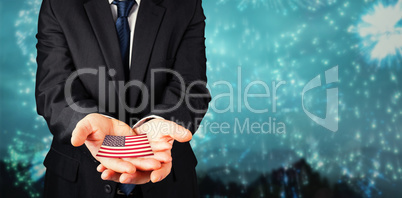 Composite image of mature businessman holding his hands out