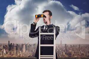 Composite image of businessman looking on a ladder