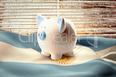 Composite image of piggy bank