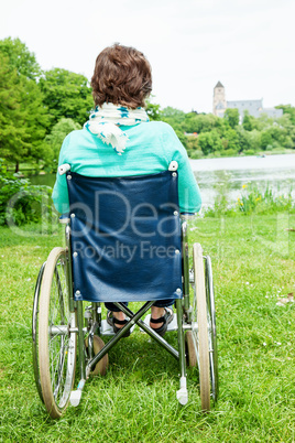 Woman with wheelchair in the park