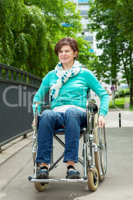 Woman with wheelchair in the park