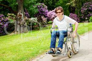 Woman with wheelchair in the park