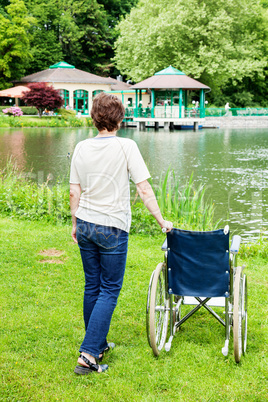 Woman with wheelchair in the park