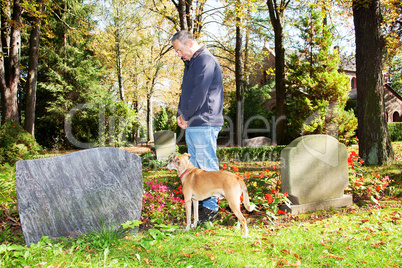 Man and dog in the cemetery