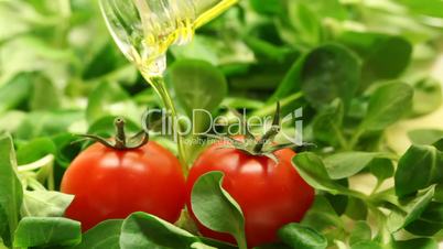 Olive oil pouring into salad