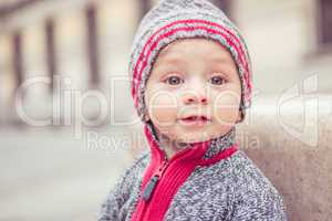 happy little baby boy wearing hat