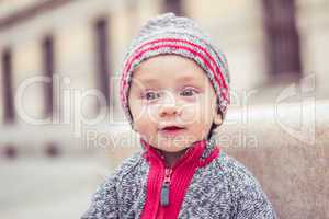 happy little baby boy wearing hat