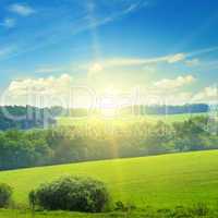 field, sunrise and blue sky