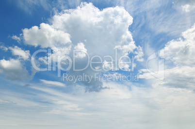 light cumulus clouds in the blue sky