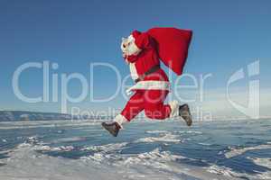 Santa Claus jumping in the winter